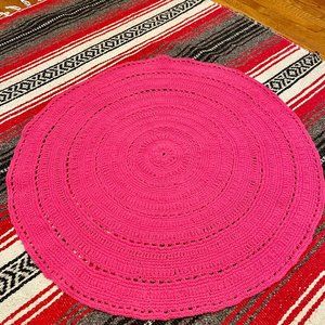 Hand knitted rug made of acrylic yarn